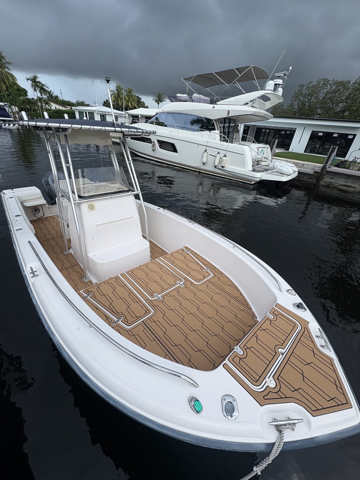 Bow deck on a center console, tan planking with a diamond pattern