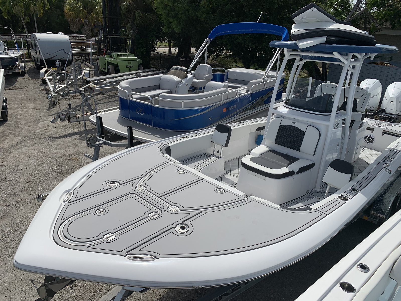 Bow deck on a center console, light gray planking with white seams